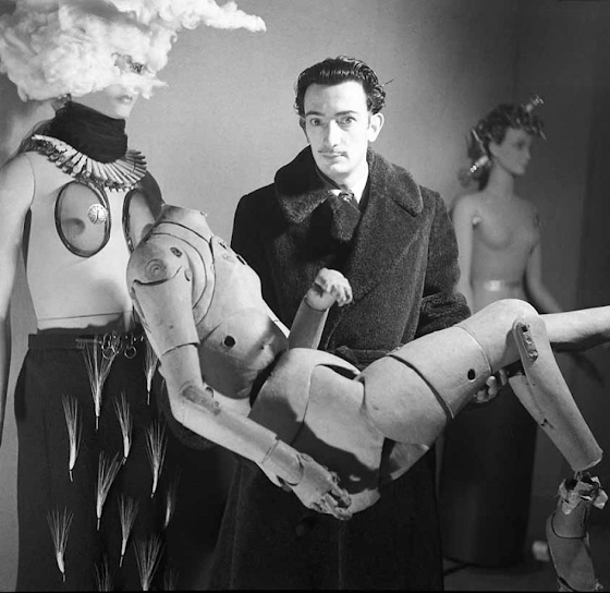Denise Bellon ~ Portrait of Salvador Dalí wearing his mannequin before the opening of the International Surrealist Exhibition at the Galerie Beaux-Arts in Paris in 1938